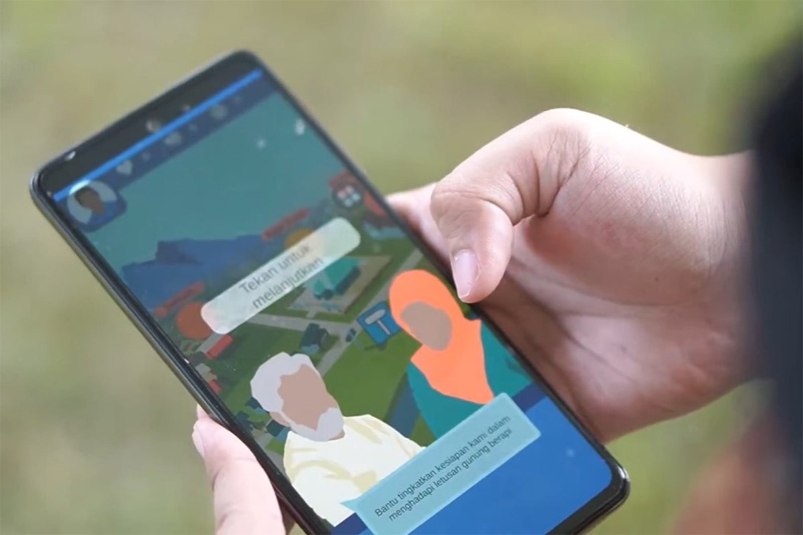 A person holding a smartphone displaying a colorful mobile game on the screen.