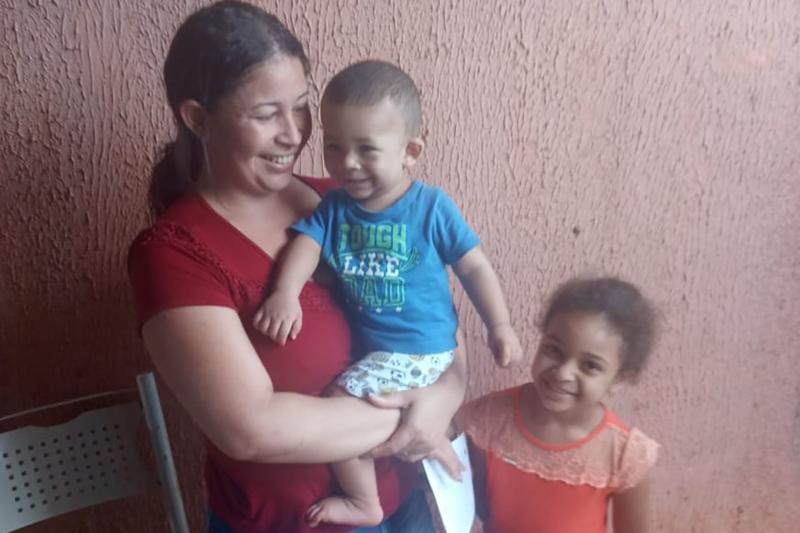 Photo of a woman and two children